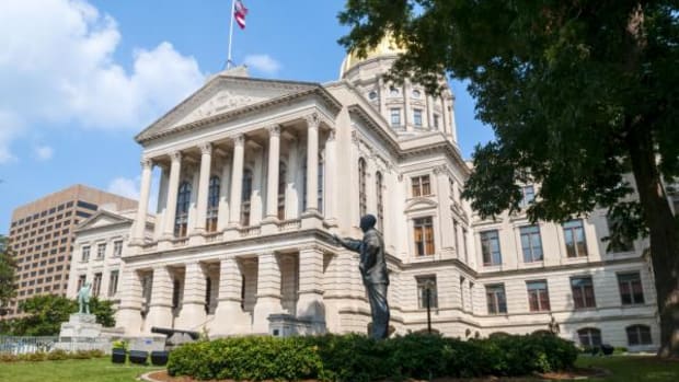A Georgia Bill Would Exempt Construction Projects From Reporting Sacred Remains - Photo: The Georgia State Capitol in Atlanta, Georgia. The statue in the foreground is of Former Senator Richard B. Russell.