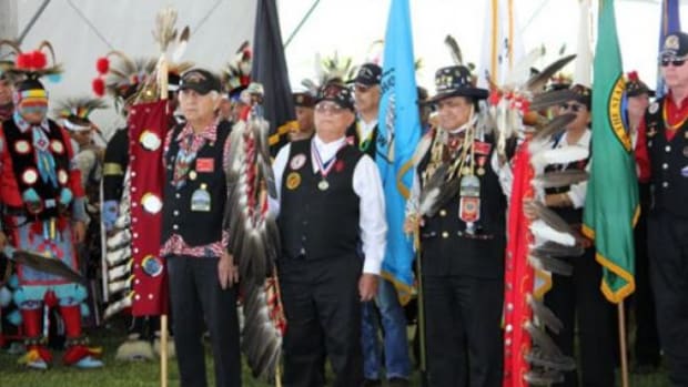 Inter-Tribal Warrior Society members along with other veterans during the grand entry at the 10th Annual Muckleshoot Pow Wow on Sunday, June 26 in Auburn, Wash.