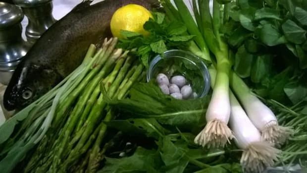 Fresh ingredients for high desert spring salad include rainbow trout, asparagus, dandelion greens, watercress, spring onion, lemon, quail eggs, and sunflower shoots.