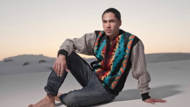 Model and Actor Martin Sensmeier, Tlingit, wearing a jacket designed by Sho Sho Esquiro, Kaska Dena and Cree.