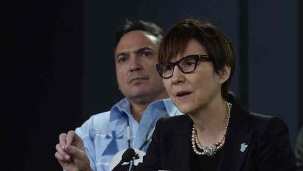 Assembly of First Nations National Chief Perry Bellegarde looks on as First Nations Child and Family Caring Society Caring Society Executive Director Cindy Blackstock speaks about the Canadian Human Rights Tribunal regarding discrimination against First Nations children in care during a news conference in Ottawa, Tuesday, January 26, 2016.