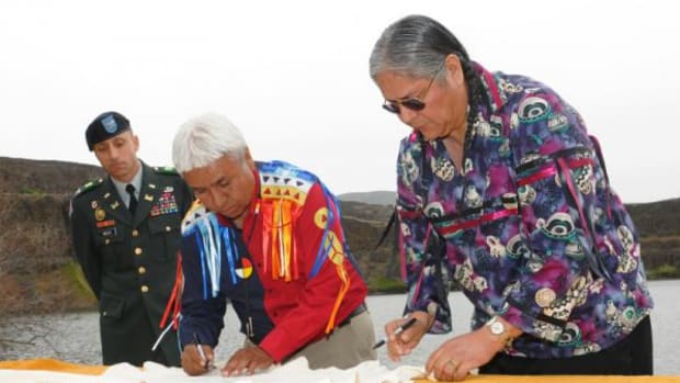 During an earlier term as chairman, Dr. Marchand signed the Columbia River Basin Fish Accords on behalf of the Confederated Tribes of the Colville Reservation. From left to right: Col. Steven Miles, Northwestern Division commander, U.S. Army Corps of Engineers; Dr. Marchand; and Ralph Sampson, at that time chairman of the Yakama Nation Tribal Council. Columbia Hills State Park, Washington; May 8, 2008.