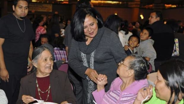 Chief Anderson speaking with elders at the Choctaw community Thanksgiving feast, November 2011.