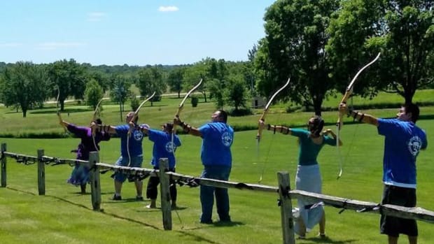 At the close of the ceremony, a 21-arrow salute was given by an archery team of students from Nebraska Indian Community College.