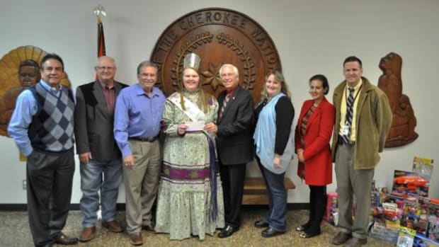Pictured, from left, are Cherokee Nation Tribal Councilors Joe Byrd and Dick Lay, Deputy Chief S. Joe Crittenden, Madison Shoemaker, Principal Chief Bill John Baker, Angel Project Coordinator Brandy Lemley, Treasurer Lacey Horn and Tribal Councilor David Walkingstick.