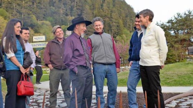 Yurok Chairman Thomas P. O'Rourke Sr. speaks with Secretary of the Interior Sally Jewell at the signing on the banks of the Klamath River.