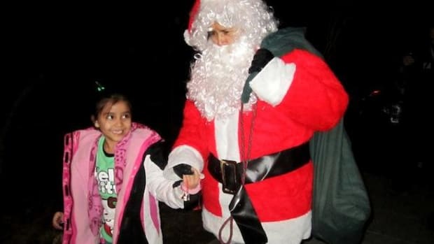 Santa Claus takes on many guises. Once he was even a Pueblo Indian woman! (Ahem. The author, with her niece, in 2009.)