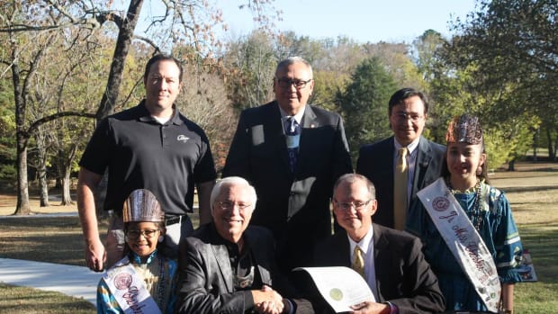 The Cherokee Nation recently purchased Sequoyah’s Cabin from the Oklahoma Historical Society. (Back Row) Bryan Warner, Cherokee Nation Tribal Councilor; Chuck Hoskin, Cherokee Nation Chief of Staff; Chuck Hoskin Jr., Cherokee Nation Secretary of State. (Front Row) Emma Fields, Little Miss Cherokee; Cherokee Nation Principal Chief Bill John Baker; Dr. Bob Blackburn, director of the Oklahoma Historical Society; and Lauryn McCoy, Junior Miss Cherokee.