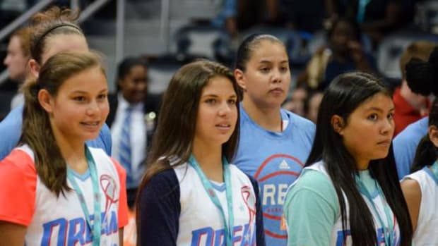 Shoni Schimmel joins the Eastern Band of Cherokee youth during the Atlanta Dream vs. Chicago Sky opening events on June 19 at the Native American Heritage night.