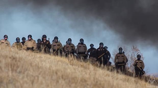 North Dakota Gov. Jack Dalrymple declared a state of emergency to marshal resources, including militarized police from seven states, to confront unarmed water protectors at Standing Rock.