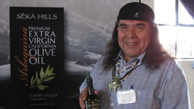 Marshall McKay, tribal chairman of the Yocha Dehe Wintun Nation, with the tribe's new olive oil at the Seka Hills Brand Launch at Mulvaney's B&amp;L restaurant in Sacramento. (By Lisa Garrigues)