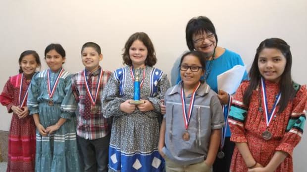 Cherokee Immersion Charter School fourth-grade class won first place for singing “Eternal Sabbath,” a traditional Cherokee song brought back from North Carolina. Students from left, are: Isabella Sierra, Ahnawake McCoy, Logan Oosahwe, Maleah Bird, Isaiah Walema and Jenna Dunn, with fluent Cherokee teacher Meda Nix.