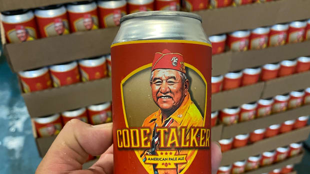 LT Goodluck holds the Code Talker beer can featuring an illustration of his grandfather, Navajo Code Talker John V. Goodluck (Photo courtesy of LT Goodluck)