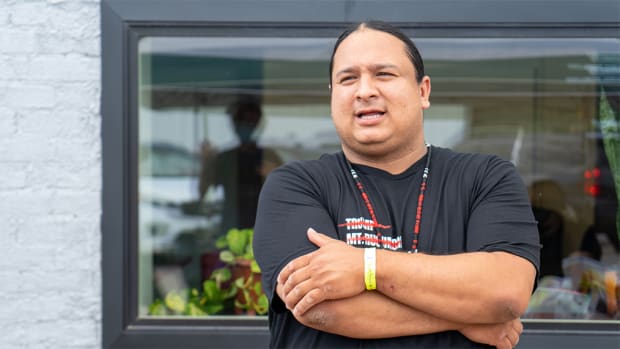 NDN Collective President and CEO Nick Tilsen stands outside of the NDN Headquarters upon his release from Pennington County jail in Rapid City, South Dakota on July 6. (Photo by Arlo Iron Cloud via NDN Collective)