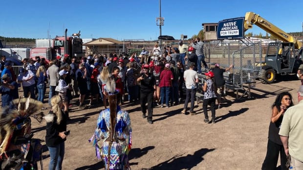 People gather on risers at the Williams, Arizona, rodeo grounds under a “Native Americans for Trump” banner Thursday, Oct. 15, 2020. (Photo by Carina Dominguez, Indian Country Today)