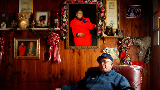 In this 2017 photo, Horace Locklear of Fairmont, N.C. a member of the Lumbee Tribe sits in his living room.  While he voted for President Obama in 2009, he voted for President Trump in 2016  because he thinks he can bring jobs to the region – and also, based on his reading of the Bible, because he doesn't think a woman should be president. (AP Photo/David Goldman)