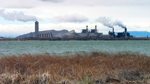 In this April 2006, file photo, is the Four Corners Power Plant in Waterflow, N.M., near the San Juan River in northwestern New Mexico. The Navajo Nation would expand its investment in coal-fired electricity generation as part of a plan announced Monday, Nov. 2, 2020, to acquire more shares in one of the Southwest's last remaining coal power plants. The Navajo Transitional Energy Co. has negotiated an agreement in which Public Service Co. of New Mexico would divest from the Four Corners Power Plant in 2024 with the tribal company taking over PNM's 13% share. (AP Photo/Susan Montoya Bryan, File)
