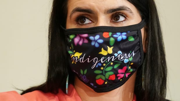 Minnesota Lt. Gov. Peggy Flanagan, whose brother died from COVID-19, wears a mask during a press conference by her and Gov. Tim Walz to announce a statewide mask mandate, Wednesday, July 22, 2020, to help slow the spread of COVID-19. (Anthony Souffle/Star Tribune via AP)