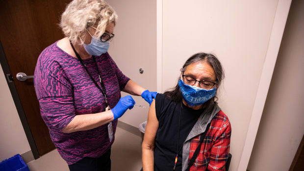 Cherokee Nation citizen Betty Frogg receives a COVID-19 vaccine on Dec. 17, 2020. The Cherokee Nation dedicated early coronavirus vaccines to front-line health care workers and Cherokee language speakers. (Photo courtesy of Cherokee Nation)