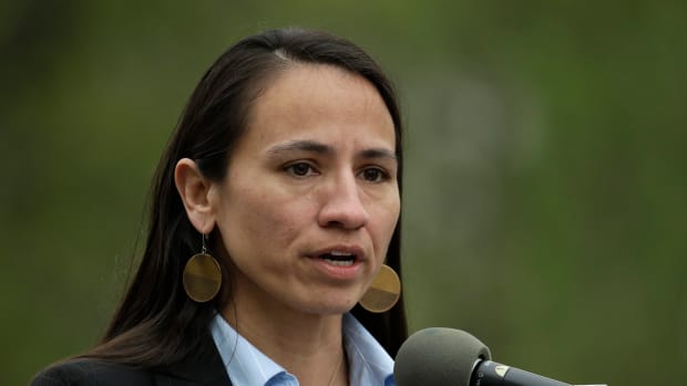 Rep. Sharice Davids, D-Kan., addresses people attending a sign unveiling ceremony for the Quindaro Townsite National Commemorative Site Tuesday, April, 23, 2019, in Kansas City, Kan. The site contains the ruins of the town of Quindaro, which was founded in the 1850s as a free state port of entry and a stop on the underground railroad for slaves to escape from Missouri located across the Missouri River from the town. (AP Photo/Charlie Riedel)