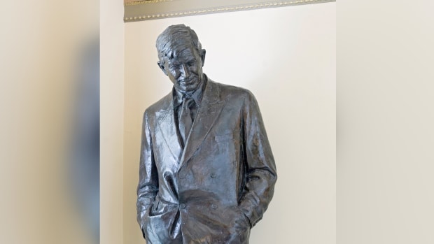 A statue of Will Rogers smiles down from his pedestal in the House connecting corridor on the second floor of the Capitol. (Photo courtesy of Architect of the Capitol/aoc.gov)