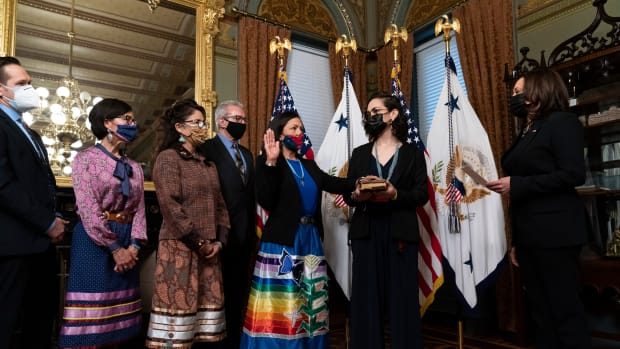 Vice President Kamala Harris, right, speaks during a ceremonial swearing in for Interior Secretary Deb Haaland, third from right, with daughter Somáh Haaland, second from right, in the Vice President's ceremonial office in the Eisenhower Executive Office Building on the White House campus, Thursday, March 18, 2021, in Washington. Haaland was confirmed by the Senate on March 15, 2021. (AP Photo/Alex Brandon)