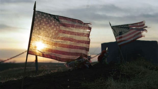 File: Flags at Ho-Chunk cemetery in Nebraska (photo by Mary Annette Pember)