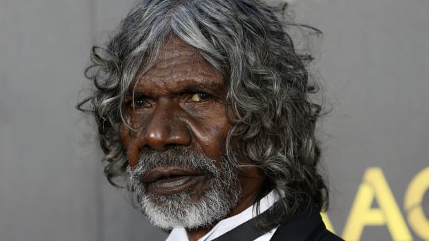 David Dalaithngu poses on the red carpet at the 2015 AFI AACTA Awards at the Star in Sydney, Thursday, Jan. 29, 2015. Dalaithngu has died of lung cancer, a government leader said on Monday, Nov. 29, 2021. He was 68 years old. (Nikki Short/AAP Image via AP)