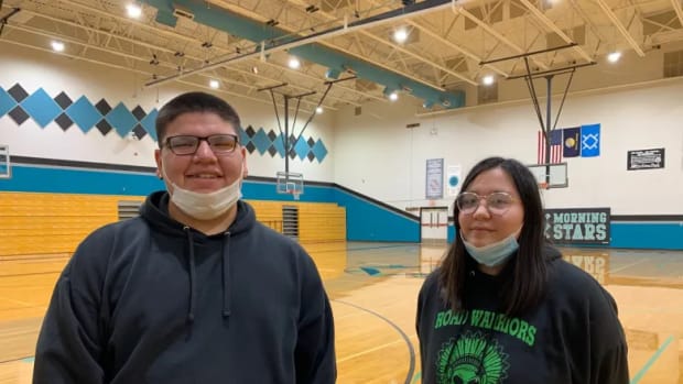 Lame Deer High School juniors Chauncey Oldman, left, and Shandiin Kaline. “Everyone just called her Carmie,” Kaline said, remembering school secretary Carmelita Onebear-Williams, who died at age 57 from COVID on Oct. 31. “She kind of really did everything,” Oldman said. “We have no nurse here, and she played that role, too.” (Credit: Jill Van Alstyne / MTFP)