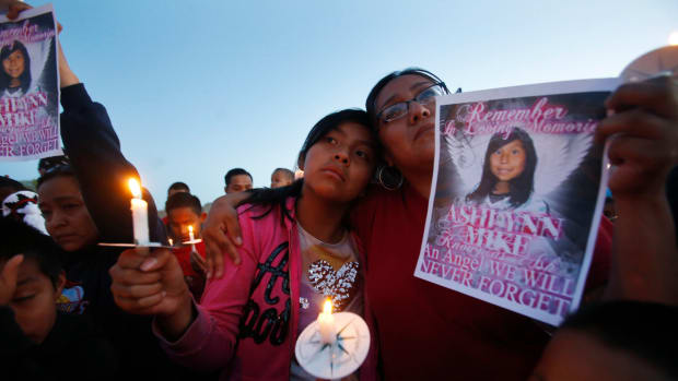 FILE - In this May 4, 2016 photo, Klandre Willie, left, and her mother, Jaycelyn Blackie, participate in a candlelight vigil in Lower Fruitland, New Mexico, for Ashlynne Mike, who was abducted and left to die in a remote spot on the Navajo Nation. Members of a congressional panel focused on civil rights and liberties shared sobering statistics Thursday, March 3, 2022, on the disproportionate number of Indigenous, Black and other minority women and girls who are missing in the United States, saying more needs to be done to tackle the problem. (Jon Austria/The Daily Times via AP, File)