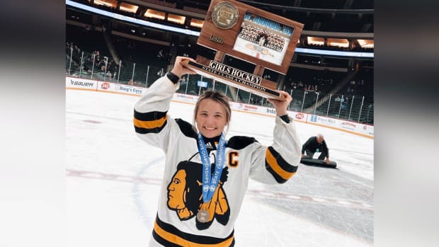 Madison Lavergne, Métis, holding the state championship trophy for the Warroad Warriors. (Photo courtesy of Layla Marvin)
