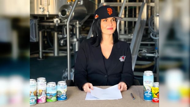 Mad River Brewing CEO Linda Cooley signing the agreement with the San Francisco Giants. (Photo courtesy of Linda Cooley)