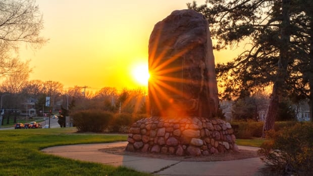 The Kaw Nation’s Sacred Red Rock called “Iⁿ ‘zhúje ‘waxóbe, was a place of cultural ceremony and gathering for the Kaw people prior to removal to Oklahoma in 1872. The stone was moved from the Kaw’s homelands near the Kansas River and Shunganunga Creek, just outside Topeka, to Robinson Park in Lawrence, Kan., as part of Lawrence’s 75th anniversary celebration in 1929, and was fitted with a plaque celebrating the pioneers of Kansas. (Photo provided by James Pepper Henry.)