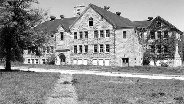 Chilocco Indian School was a federal off-reservation boarding school established to house, civilize, Christianize, educate, and transform American Indian youth. Thousands of Native children and young adults passed under the school's entryway arch. In January 1884, Chilocco opened its doors in 1884 to 150 children from the Cheyenne, Arapaho, Wichita, Comanche, and Pawnee tribes. It closed in 1980. (Photo courtesy Oklahoma History Center)