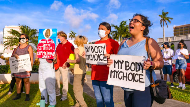 "My body, my choice!" resonates from protesters on the front lawn of the Guam Congress Building in Hagåtña during a protest as they voiced their concerns against the Guam Heartbeat Act of 2022 on April 27, 2022. Women from the remote U.S. territories of Guam and the Northern Mariana Islands will likely have to travel farther than other Americans to terminate a pregnancy if the Supreme Court overturns a precedent that established a national right to abortion in the United States. (Rick Cruz/The Pacific Daily via AP, File)