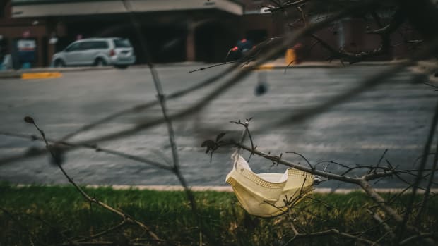 During the COVID-19 pandemic patients and visitors have been arriving at the hospital wearing masks, gloves, and all sorts of protective gear - many items are discarded in the parking lot and surrounding area in McLaren Central Michigan. (Photo courtesy of Dan Gaken, Creative Commons)