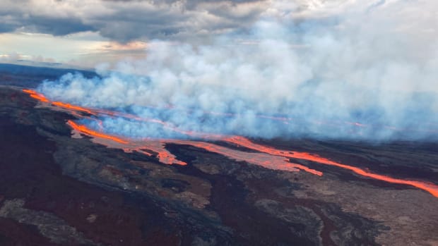 In this aerial photo released by the U.S. Geological Survey, the Mauna Loa volcano is seen erupting from vents on the Northeast Rift Zone on the Big Island of Hawai'i, Monday, Nov. 28, 2022. Hawai'i's Mauna Loa, the world's largest active volcano, began spewing ash and debris from its summit, prompting civil defense officials to warn residents on Monday to prepare in case the eruption causes lava to flow toward communities. (U.S. Geological Survey via AP)