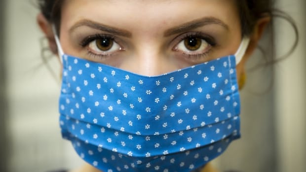 Pictured: Woman wearing a mask to protect against cold, flu, COVID-19. Christo Anestev, Pixabay