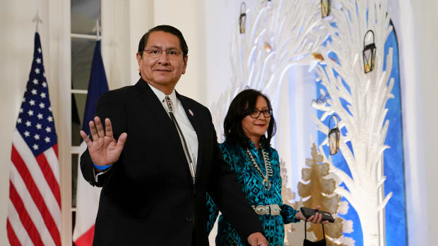 President of the Navajo Nation Jonathan Nez, left, and Phefelia Nez, right, arrive for the State Dinner with President Joe Biden and French President Emmanuel Macron at the White House in Washington, Thursday, Dec. 1, 2022. (AP Photo/Susan Walsh)