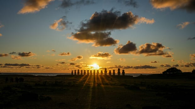 The sun rises behind a line of moai statues on Ahu Tongariki, Rapa Nui, or Easter Island, Chile, Saturday, Nov. 26, 2022. Each monolithic human figure carved centuries ago by this remote Pacific island's Rapanui people represents an ancestor. (AP Photo/Esteban Felix)