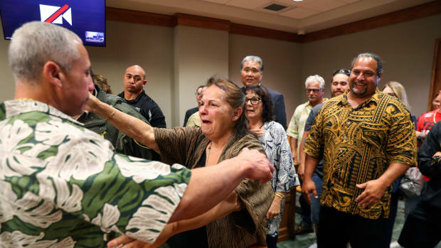 Albert "Ian" Schweitzer, left, hugs his mother, Linda, moments after a judge ordered him released from prison, in Hilo, Hawai'i, Tuesday, Jan. 24, 2023. The judge's ruling came immediately after Schweitzer's attorneys presented new evidence and argued that Schweitzer, Native Hawaiian, didn’t commit the crimes he was convicted of and spent more than 20 years locked up for: the 1991 murder, kidnapping and sexual assault of a woman visiting Hawai'i. (Marco Garcia/The Innocence Project via AP Images)