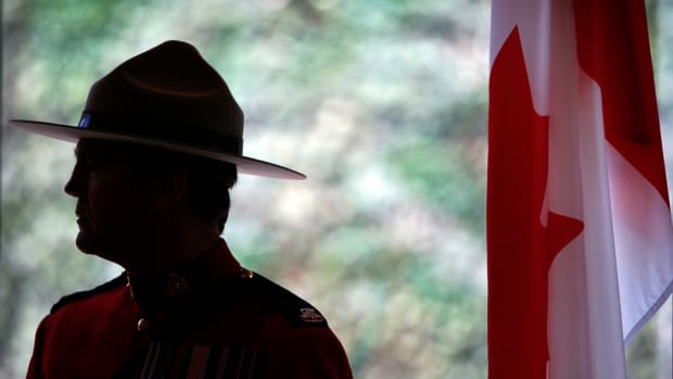 Royal Canadian Mounted Police Constable Jean Juneau stands at Canada Pavilion in World Expo site Wednesday, June 2, 2010 in Shanghai, China. (AP Photo/Eugene Hoshiko)