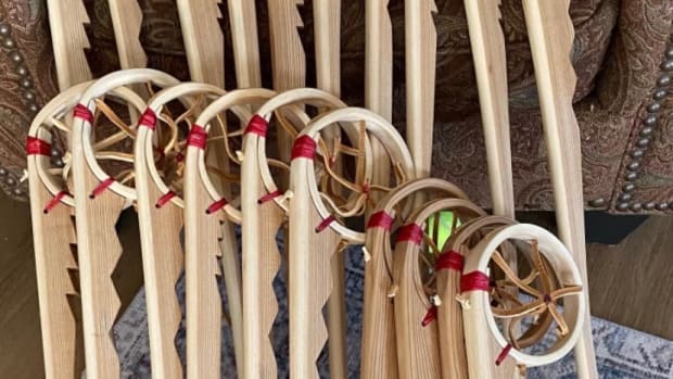 The Ojibwe wooden sticks, baaga’adowaanan, made by Thomas Howes with his trademark jagged design under the pocket. (Photo courtesy of Thomas Howes)