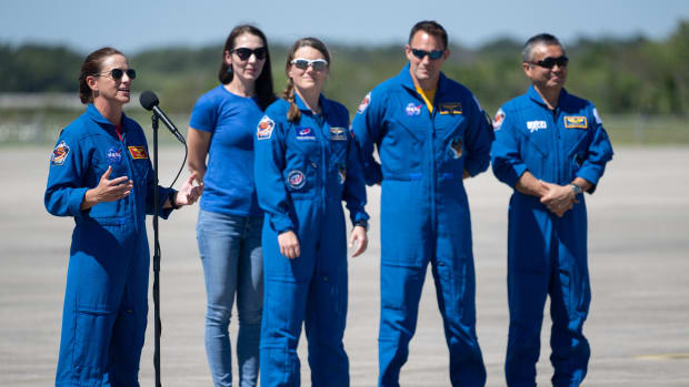 NASA astronaut Nicole Mann, left, speaks to members of the media after arriving at the Launch and Landing Facility with fellow crew members Roscosmos cosmonaut Anna Kikina, second from left, NASA astronaut Josh Cassada, second from right, and Japan Aerospace Exploration Agency (JAXA) astronaut Koichi Wakata, right, at NASA’s Kennedy Space Center ahead of SpaceX’s Crew-5 mission, Saturday, Oct. 1, 2022, in Florida. NASA’s SpaceX Crew-5 mission is the fifth crew rotation mission of the SpaceX Crew Dragon spacecraft and Falcon 9 rocket to the International Space Station as part of the agency’s Commercial Crew Program. Mann, Cassada, Wakata, and Kikini are scheduled to launch at 12:00 p.m. EDT on Oct. 5, from Launch Complex 39A at the Kennedy Space Center. Photo Credit: (NASA/Joel Kowsky)