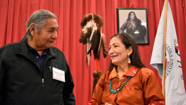 Russell Eagle Bear, with the Rosebud Sioux Reservation Tribal Council, talks to U.S. Interior Secretary Deb Haaland during a meeting about Native American boarding schools at Sinte Gleska University in Mission, S.D., Saturday, Oct. 15, 2022. Haaland has been holding events across the nation to shed light on the abuse suffered by many Native American children forced to attend the government-backed schools. (AP Photo/Matthew Brown)