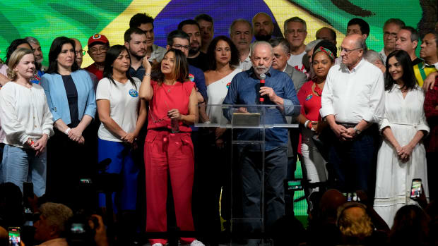 Former Brazilian President Luiz Inacio Lula da Silva, center, speaks after polls closed in a presidential run-off election in Sao Paulo, Brazil, on Sunday, Oct. 30, 2022. Lula of the leftist Worker's Party defeated incumbent President Jair Bolsonaro to become the country's next president. (AP Photo/Andre Penner)