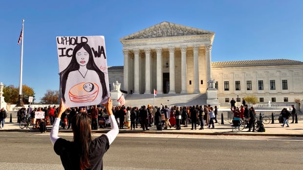 The U.S. Supreme Court heard oral arguments Wednesday, Nov. 9, 2022, in Haaland v. Brackeen, a case that will decide if the ICWA is constitutional. Kimberly Jump-CrazyBear, Osage and Oglala, from Virginia, hold a sign in support of ICWA. (Jourdan Bennett-Begaye, ICT)