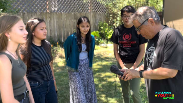 A new radio program, "Indigenous YOUth Nation," is aimed at Native youths in remote locations where radio plays an important role. Here, producer Gregg McVicar explains details of audio recording to four participants, from left, Bahiyyah, Dahi, Deezhchiil and Bahozhoni. (Photo courtesy of Jeneda Benally)