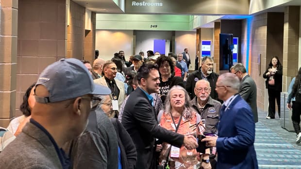 Members of the National Congress of American Indians lined up at the polls Thursday morning at the 80th annual NCAI convention, hosted in New Orleans, Louisiana this year. Voting topics included the race for the new presidential election and two proposed constitutional amendments that would exclude state recognized tribes from voting membership. (Photo Courtesy of Eddie Sherman)