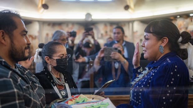 Crystalyne Curley raises her right hand and takes the oath to lead the Navajo Nation 25th Council. Curley is the first woman to serve as Speaker of the tribal government council. (Photo by Sharon Chischilly for Source NM)